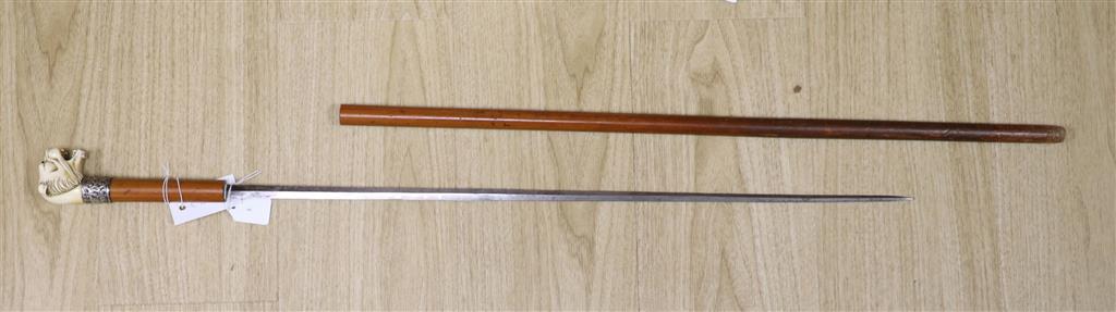 A Victorian sword cane, ivory lions head pommel with glass eyes, silver band H.M.Birmingham 1898, maker WS&ES, blade with traces